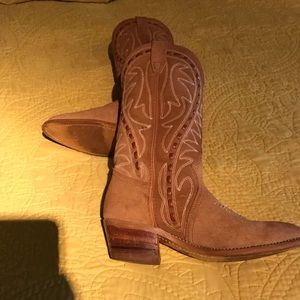 Tan leather cowboy boots.